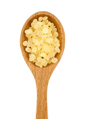 flat lay pile of mastic gum or tear of chios in wood spoon cutout