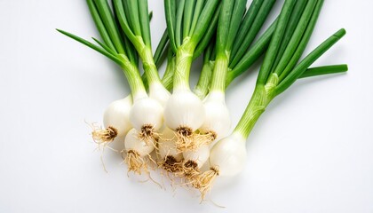 Obraz premium Fresh Green Onions and Two Whole Onions Displayed Together in a Rustic Kitchen Setting for Cooking