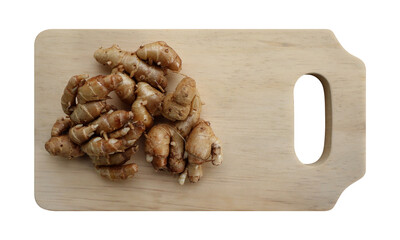 Aromatic ginger on wooden cutting board on transparent background