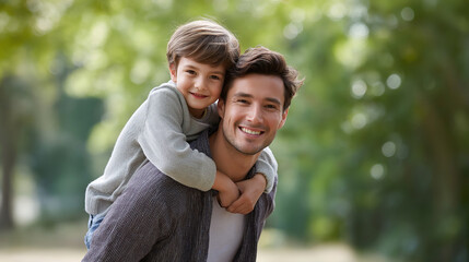 Fototapeta premium Father and son share a joyful piggyback ride in a park