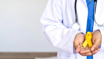 Doctor's Hands Holding a Yellow Awareness Ribbon: Symbolizing Suicide Prevention, Childhood Cancer Awareness and World Cancer Day