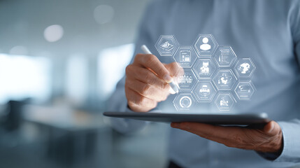 Businessman using tablet for data analysis and strategic business planning with modern technology interface