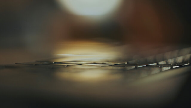 Programmer writing code on blurred laptop keyboard in office