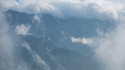 Fog flowing on hills and sky