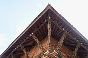 Obraz premium Intricate Woodcraft Detailing on Traditional Temple Architecture- 2025-07-09