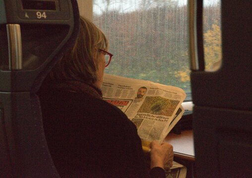 Woman reading newspaper
