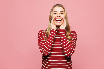 Young happy woman she wearing red striped sweatshirt casual clothes scream sharing hot news about...