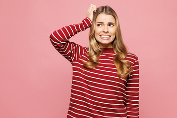 Young sad shocked confused mistaken woman she wear red striped sweatshirt casual clothes put hand...