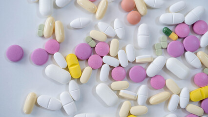 Pills, tablets, capsules, vitamins and omega3 on the white table