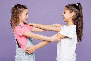 Side profile view cool little two friends kids children girls 9-10 years old wear casual clothes...