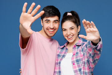Close up young couple two friends family man woman they wearing pink casual clothes together...
