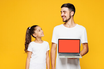Young parent IT man with child girl wear casual blue pyjamas clothes. Daddy little kid hold use...