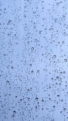 Innovative rainwater harvesting system concept with raindrops on glass, representing sustainable water management and eco-friendly infrastructure