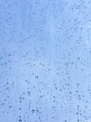 Detailed rain droplet pattern highlighting climate change effects, extreme weather frequency, and altered precipitation trends