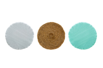 bale of straw, and bale of straw wrapped with white tape. technology of preserving hay for...
