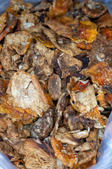 Close-up of dried amanita mushrooms with natural texture and bright colors. Concept of herbal medicine, alternative healing.
