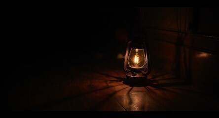Glowing Vintage Lantern on Dark Wood Floor - Atmospheric Lighting