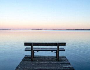 Naklejka premium Minimalist Bench on Dock Overlooking Calm Lake