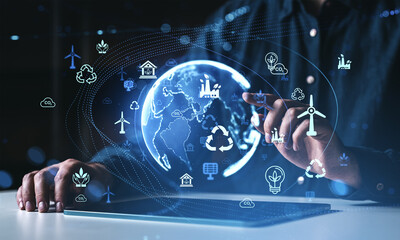Sustainable technology interface with globe and renewable energy icons displayed.
