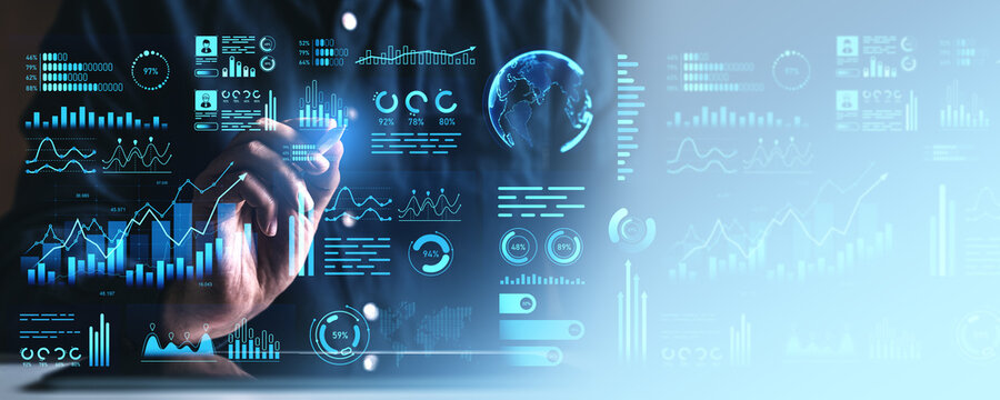Businessman analyzing futuristic digital financial data charts on screen interface.