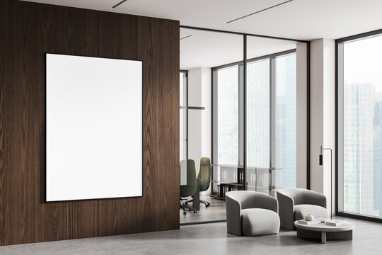 Blank poster mockup on wooden wall in modern office interior with armchairs, coffee table and large windows overlooking cityscape, perfect for design display. 3D Rendering