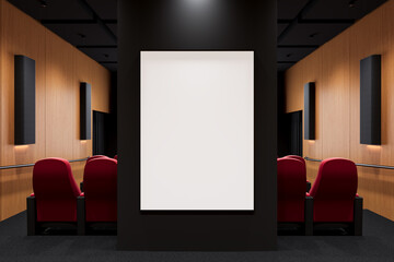 Blank vertical canvas mockup on dark wall in modern theater interior with red chairs and wood paneling, perfect for advertising or artwork display. 3D Rendering