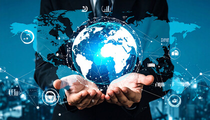 Businessman holding glowing globe with digital connections, symbolizing global communication and technology