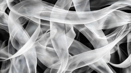 A black and white abstract image of flowing ribbons gracefully intertwining creating a dynamic and ethereal composition
