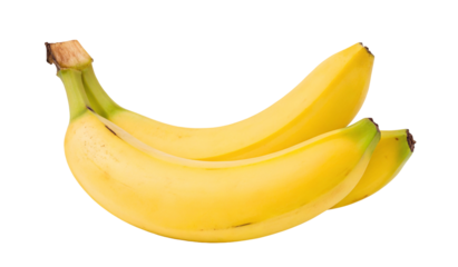 Healthy ripe bananas on black isolated background with high contrast vibrant yellow color