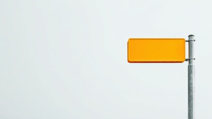 Bright Yellow Sign on Metal Pole Against a Plain White Background, Ideal for Custom Text