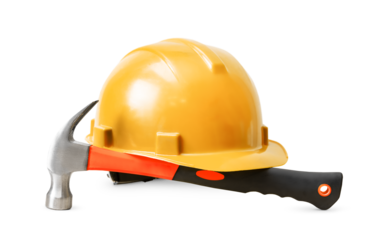 construction helmet and hammer on white isolated background