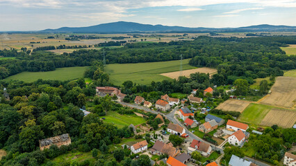 Aerial drone photo of the village of Siedlimowice in Lower Silesia, surrounded by farmland and...