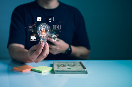 Innovative learning concept with man holding glowing light bulb and education icons, symbolizing knowledge, creativity, e-learning, and academic growth in modern technology.