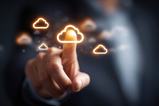 Close-up of hand pointing to glowing cloud icons, suggesting cloud computing
