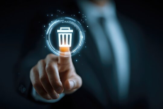 Businessperson's finger activates a digital trash can icon