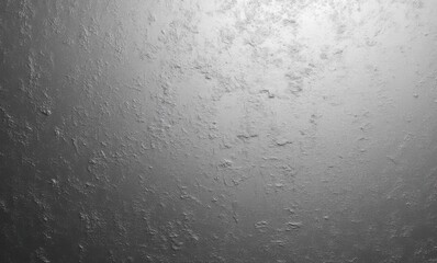 Abstract texture of a rough, gray surface with subtle variations in light and shadow.