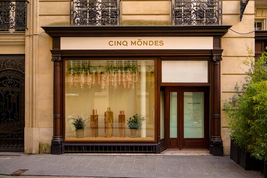 paris france ,06 06 2025: parisian vintage and fancy shop vitrine and wooden storefront