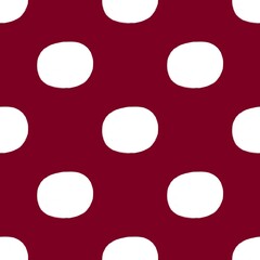 White circle dots on a continuous red background pattern