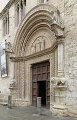 Main portal of Palazzo dei Priori (Palazzo Comunale) with sculptures and gothic decoration,...
