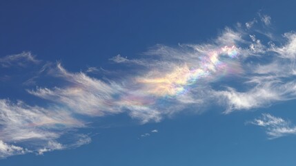 Naklejka premium Iridescent Cloud Displaying Rainbow Colors Against Blue Sky Backdrop - Atmospheric Optical Phenomenon Meteorology