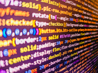 Data bits computer bits, shadow and dark vignette effect. HTML code on the screen editor, dark...