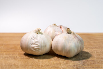 Close-up of a fresh garlic bulb isolated on a clean white background for culinary and health concept