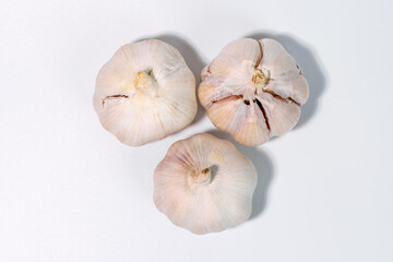 Close-up of a fresh garlic bulb isolated on a clean white background for culinary and health concept
