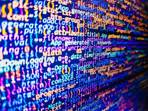 Source code close-up. Developer working on software codes in office. Internet connection stream flow concept. Abstract source code background. Computer script typing work