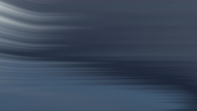 Blurry curved gray lines suitable for abstract backgrounds, technology concepts, digital design elements, motion graphics, and artistic overlays.