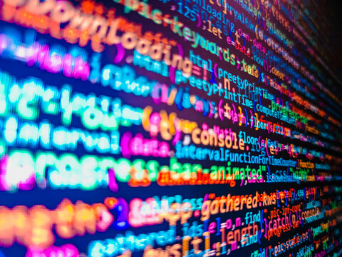 Programming Coding with editor colorful themes. Hacker breaching net security. PHP syntax highlighted. Trendy design. JavaScript code in text editor. Closeup of Java Script and HTML code