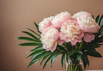 Fresh Pink Peonies with Green Leaves in a Simple Vase Against a Soft Brown Background for Floral Arrangement Inspiration