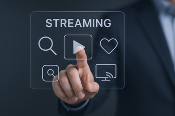 Obraz premium Man Interacting with Streaming Service Interface on Futuristic Transparent Screen Displaying Play, Search, and Like Icons