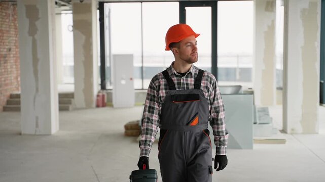 Construction worker walking in unfinished building