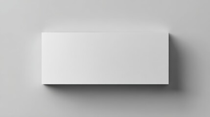 Blank White Business Card Mockup on a Neutral Gray Surface for Professional Branding and Design